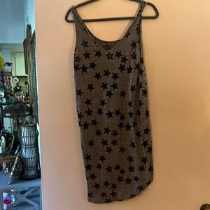 Brand sweet Clair gray with black stars.hangs longer in the back of shirt.